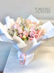 light pink and white roses bouquet in white wrapping