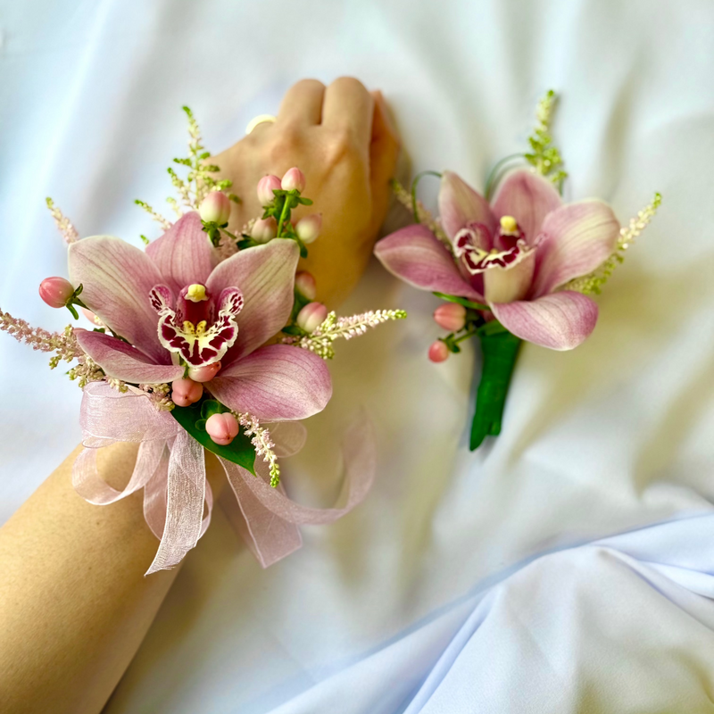 Pink cymbidium orchid corsage.