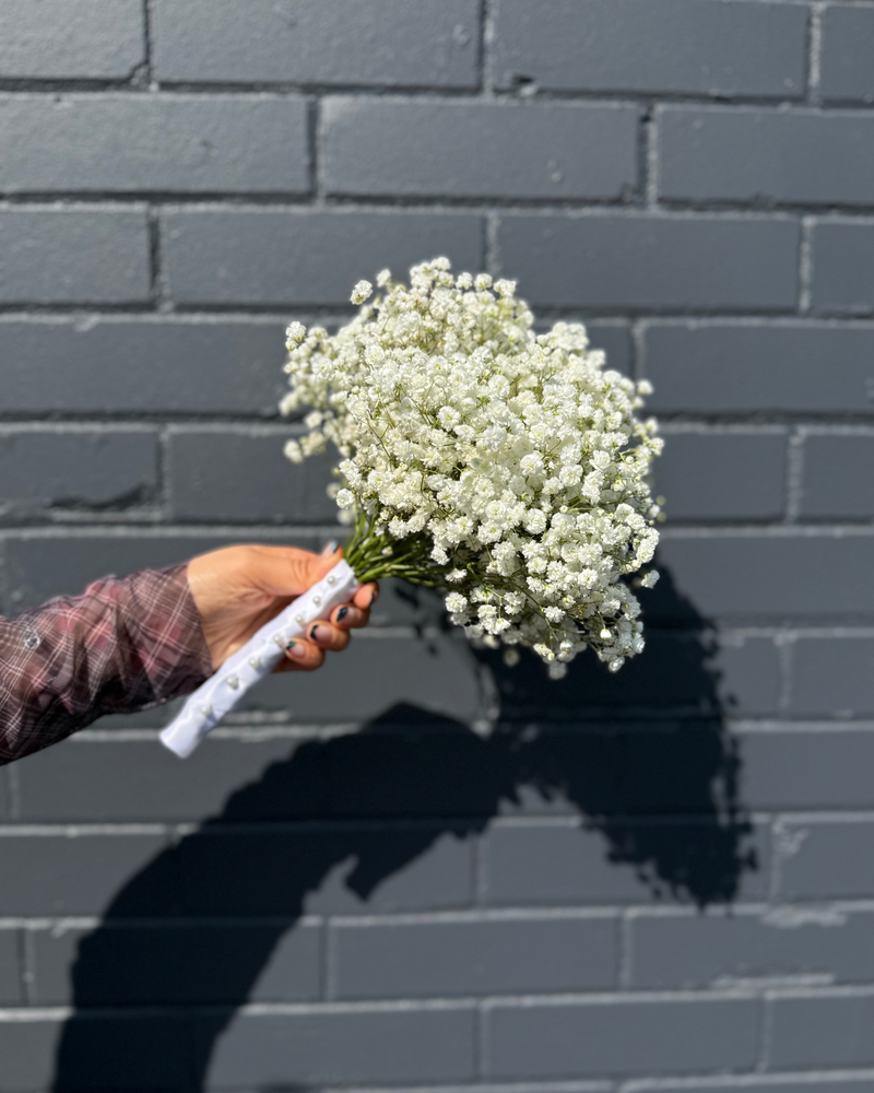 Bridal bouquet of delicate white baby’s breath.