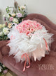 bouquet of pink roses with lush white and light pink wrapping