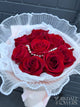 Red rose bouquet with pearl detail and pink wrapping