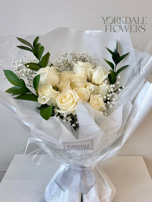 White rose bouquet in white wrapping