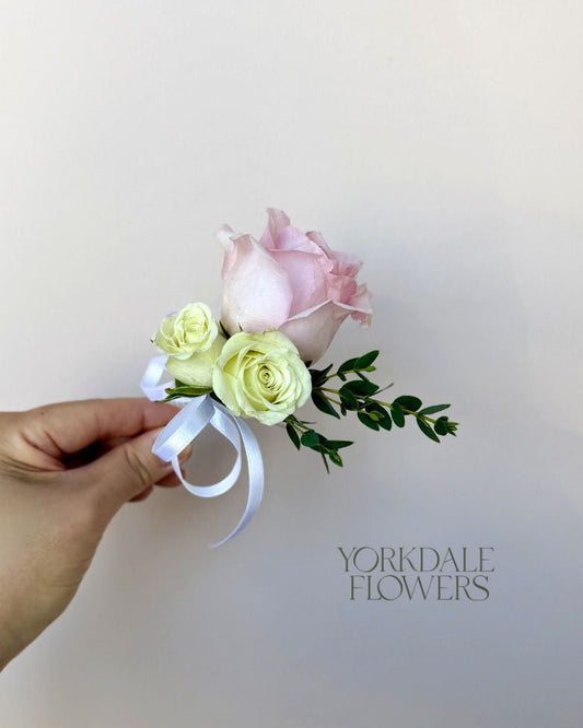 light pink rose and white mini rose boutonniere
